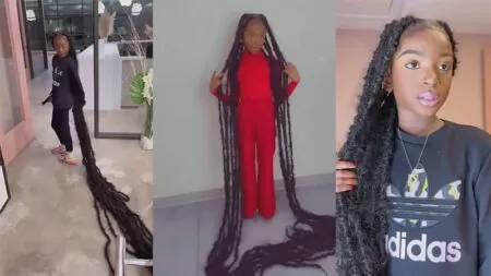 her dreadlocks are so long that they drag on the floor as she walks.