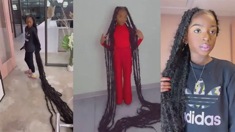 her dreadlocks are so long that they drag on the floor as she walks.